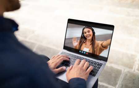 Man Video Chatting With Woman Outdoors During Daytimeの写真素材