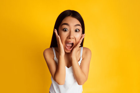 Woman In White Tank Top Expresses Shock Over Yellow Background