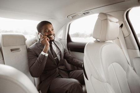 Businessman in Suit Making Phone Call While Riding in Car
