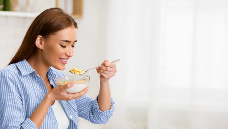 Woman Eating Cereal in Kitchen