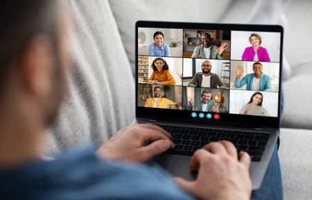 A Man Participating in a Video Conference With Multiple Participants