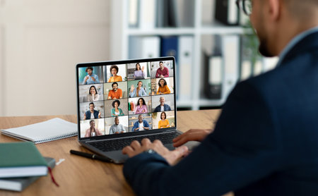 Businessperson Participating in a Video Conference Meeting at a Desk