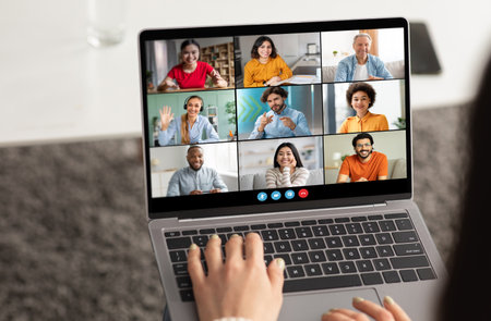 Woman Participating In A Video Conference With Eight People