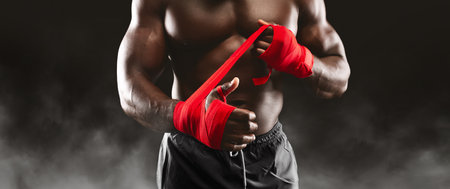 Boxer Wrapping Hands With Red Tapeの写真素材