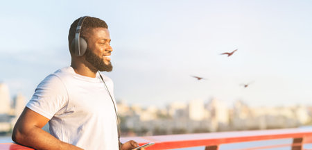 Joyful man having break while exercising open airの写真素材