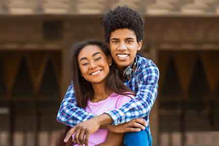 Smiling Teenage Couple Posing Together In Cityの写真素材