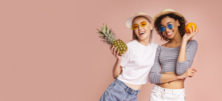 Two Happy Women Holding Fruits In Summer Hats