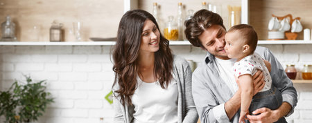 Happy Family In A Modern Kitchen With White Brick Walls
