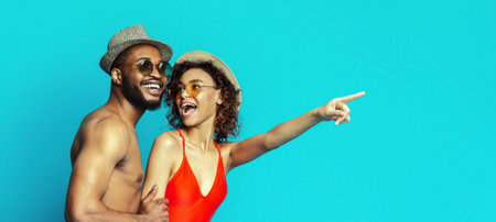Happy Couple Pointing To The Right While Wearing Summer Clothes