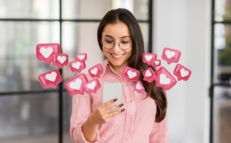 Woman Checking Smartphone For Social Media Likes In Modern Office