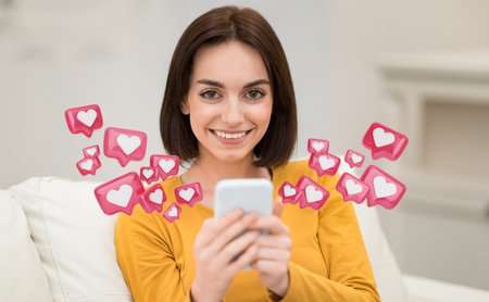 Woman Smiling at Smartphone Surrounded by Hearts, Sitting on Couch