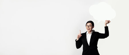 Businesswoman Holding Thought Bubbleの写真素材