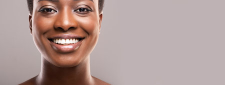 Portrait of black woman with perfect skin and white teeth
