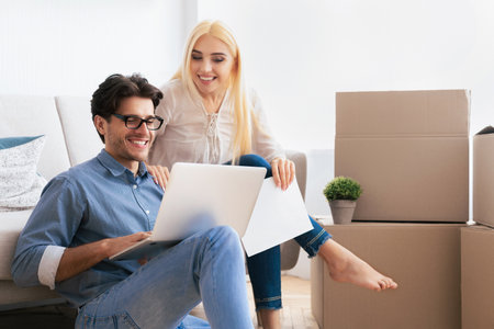 Couple Using Laptop While Moving