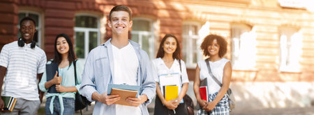Student Leader Concept. Handsome Teen Guy Posing Outdoors Of University Campus