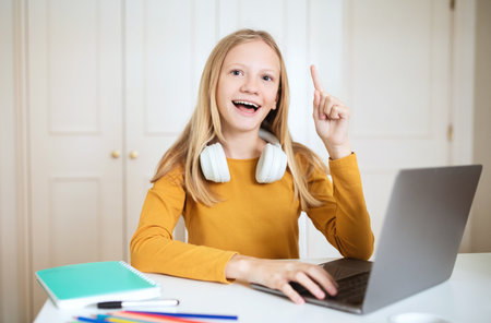 Smiling Girl Using Laptop, Having Idea While Studying at Home