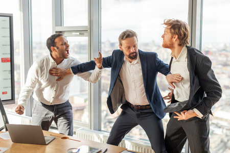 Three Men Arguing In A Modern Office During The Dayの写真素材