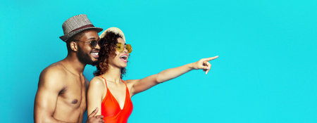 Happy Couple Posing Against Blue Background In Summer