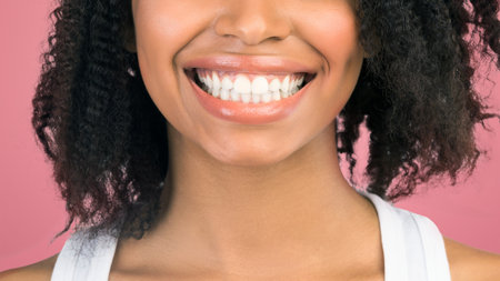 Cheerful black girl smiling and looking at camera