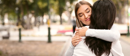 Sly Girl Embracing Desperate Girlfriend Pretending To Support Her Outside