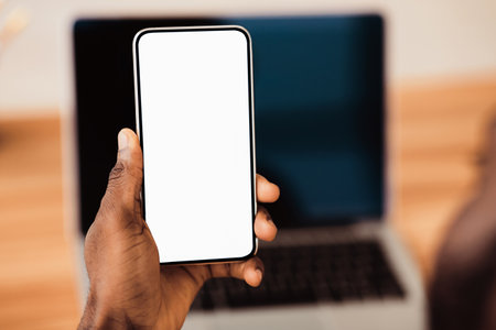 African american using black phone with blank screenの写真素材