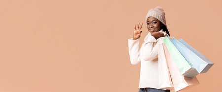 Happy Woman in Sweater and Hat Happily Showing Shopping Bags
