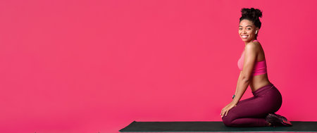 Young athletic girl enjoying sporty healthy lifestyle, smiling at cameraの写真素材