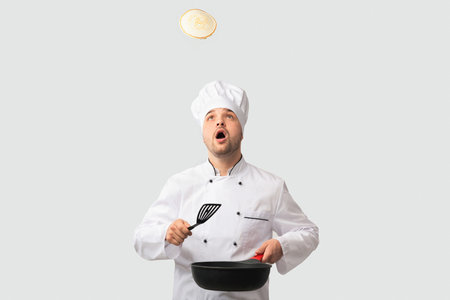 Surprised Chef Man Holding Pan Looking Up Standing, Studio Shotの写真素材