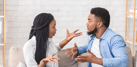 African american couple arguing at psychotherapist sessionの写真素材