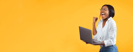 African American Girl Holding Laptop Gesturing Yes, Pink Background, Panoramaの写真素材