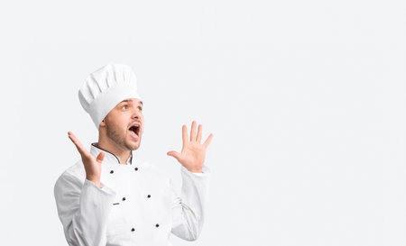 Excited Chef In Uniform Shouting Standing On White Background, Panoramaの写真素材