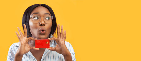 Funny Lady Holding Credit Card Near Face, Pink Background, Panoramaの写真素材