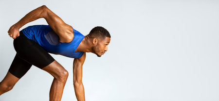 Serious afro guy preparing for a run at studio