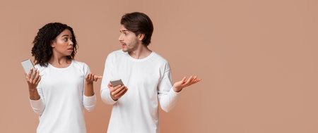 Jealos Guy Catching Girlfriend Chatting With Another Man On Smartphone