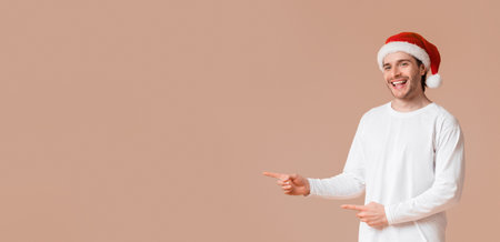 Happy interracial couple pointing fingers at copy space in the middleの写真素材