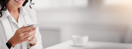 Unrecognizable latin girl writing message on lineの写真素材