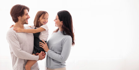 Happy Family Of Three Embracing And Bonding Together At Home