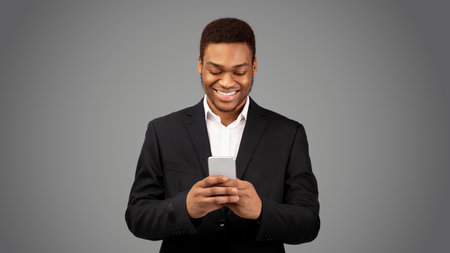 Portrait of smiling handsome afro man sending message