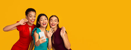 Three Girls Waving Hands Making Selfie, Studio Shot, Panorama