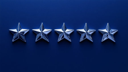 Five metallic stars aligned on a blue background showcasing a decorative design and shineの素材