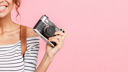 Happy woman with passport and retro camera
