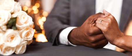 Cropped image of black couple in restaurantの写真素材