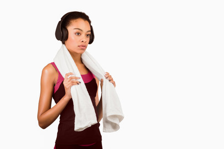 Afro Lady In Headphones Holding Towel Standing Over White Backgroundの写真素材