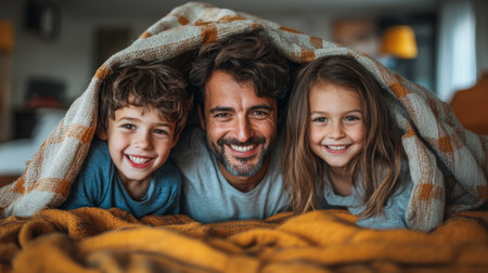 Cozy family morning indoors with a father and two children cuddled under a warm blanket on a colorful bed. Generative AIの素材