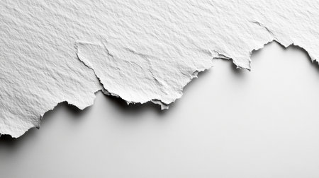 Torn white paper with textured edges creating a soft contrast on a smooth background in a minimalist composition. Generative AIの素材