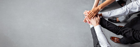 Unrecognizable Coworkers Holding Hands Standing In Office, Cropped, Above View