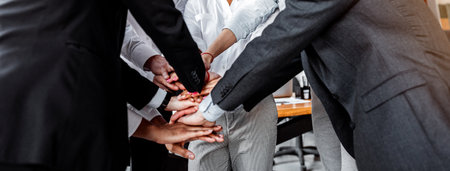Joyful Colleagues Holding Hands Standing In Circle In Modern Office
