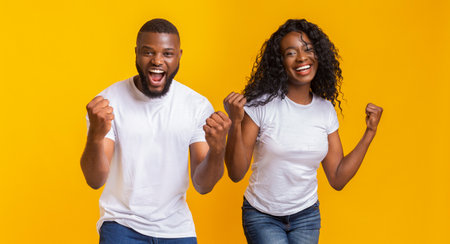 African american man and woman rejoicing successの写真素材