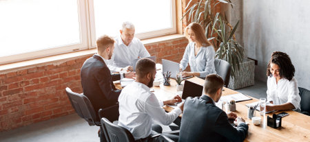 Multiracial Business Team Working Sitting At Desk In Office, High-Angleの写真素材