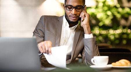 Portrait of black manager talking on mobile phone
